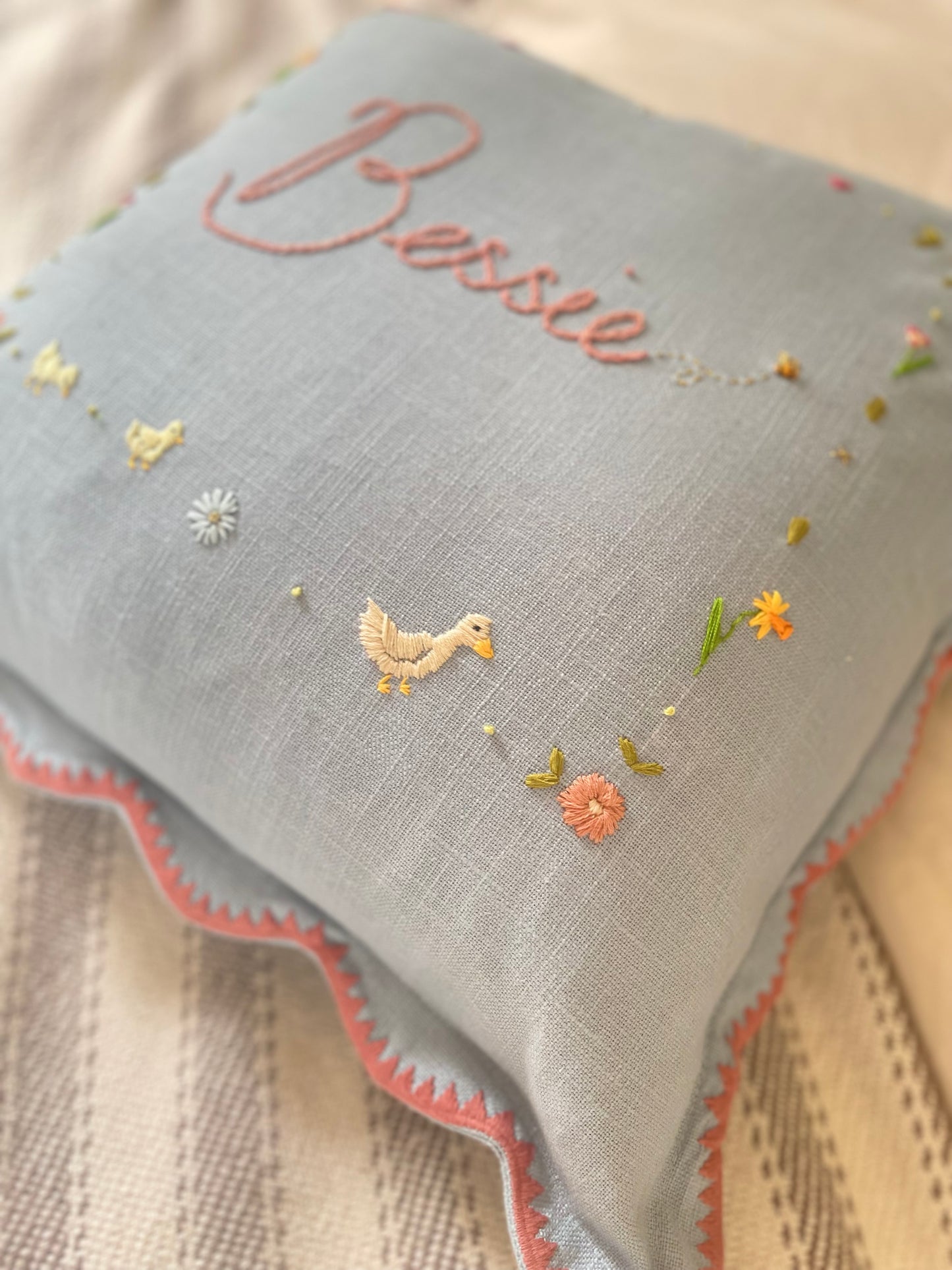 Hand Embroidered Bespoke Nursery Pillow Blossom and Bramble Embroidery Blue Scallop with pink trim